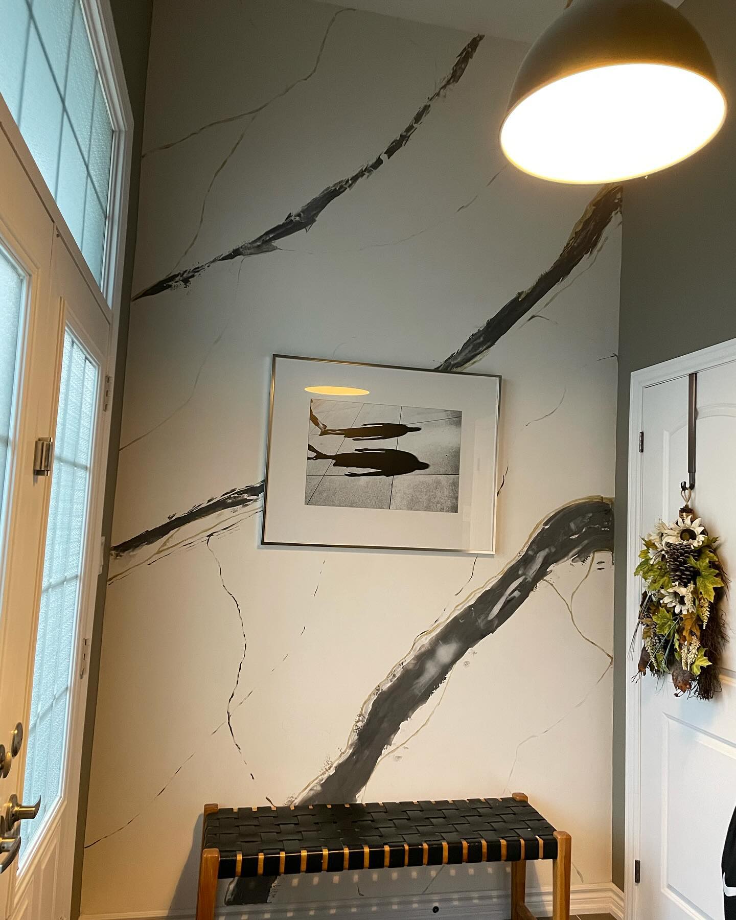 Close-up of marble wall painting with ceiling light