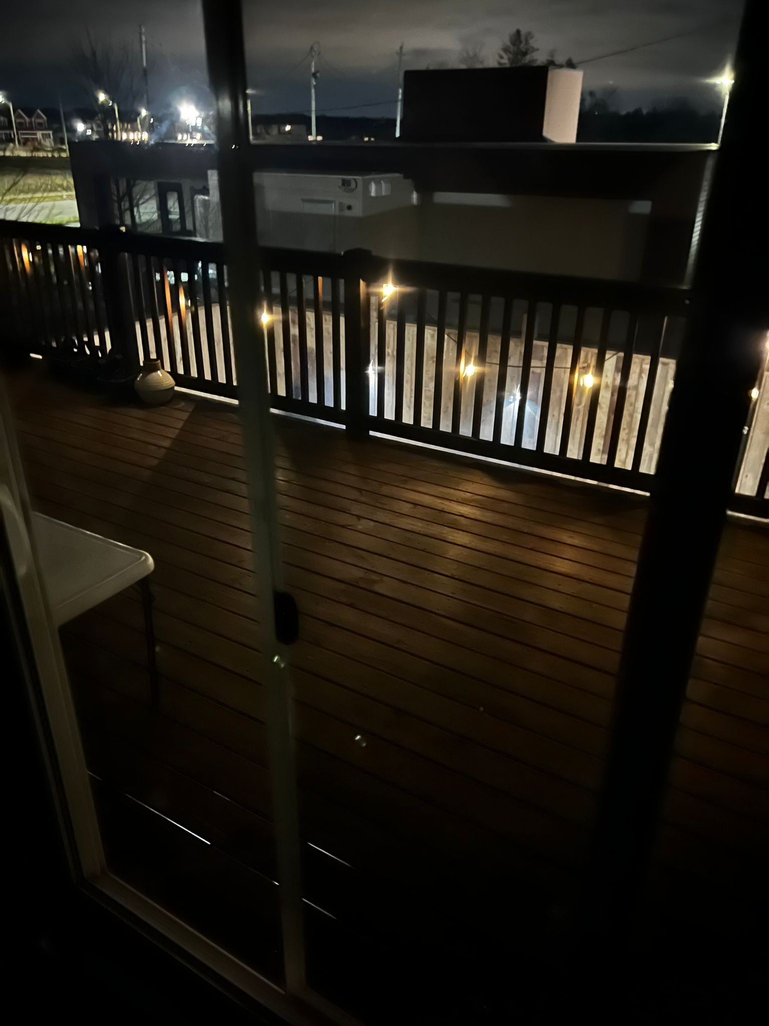 Finished deck with string lights at night